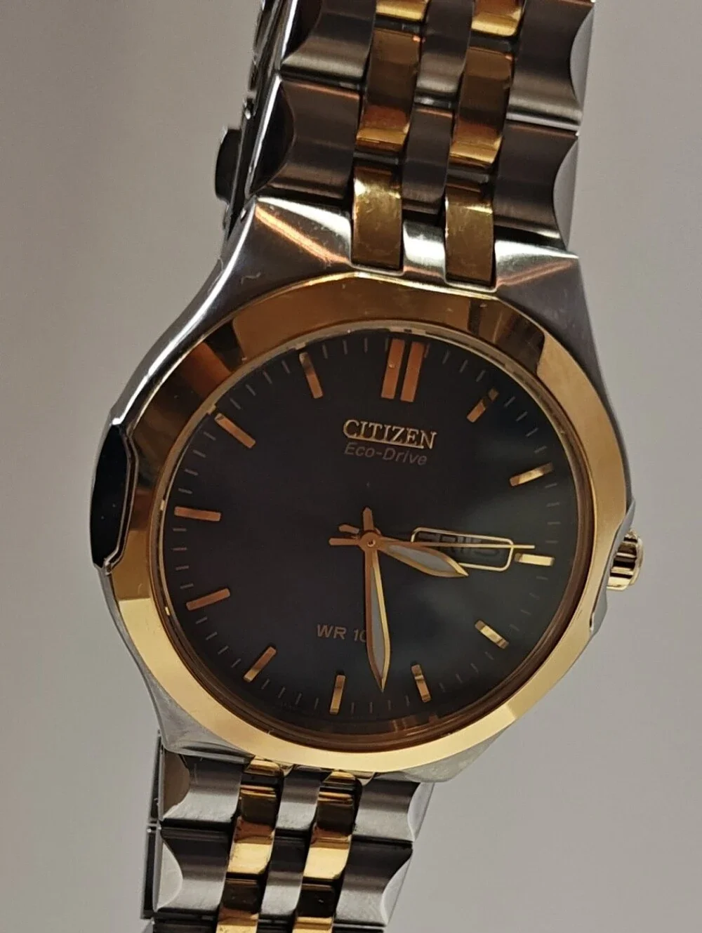 Citizen Eco-Drive Two-Tone Watch with Black Dial and Gold Accents